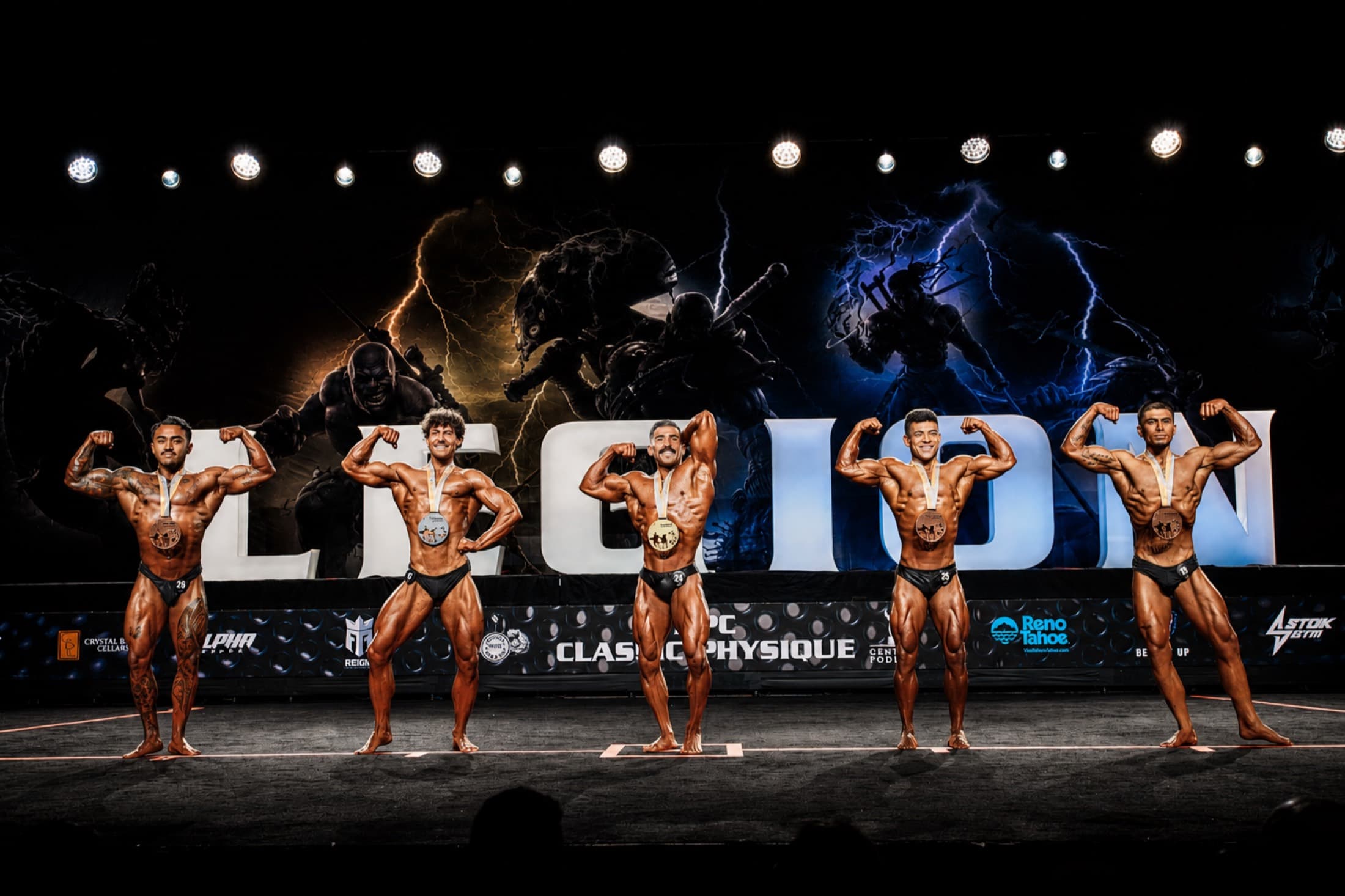 Coach Chris competing on stage at a bodybuilding show